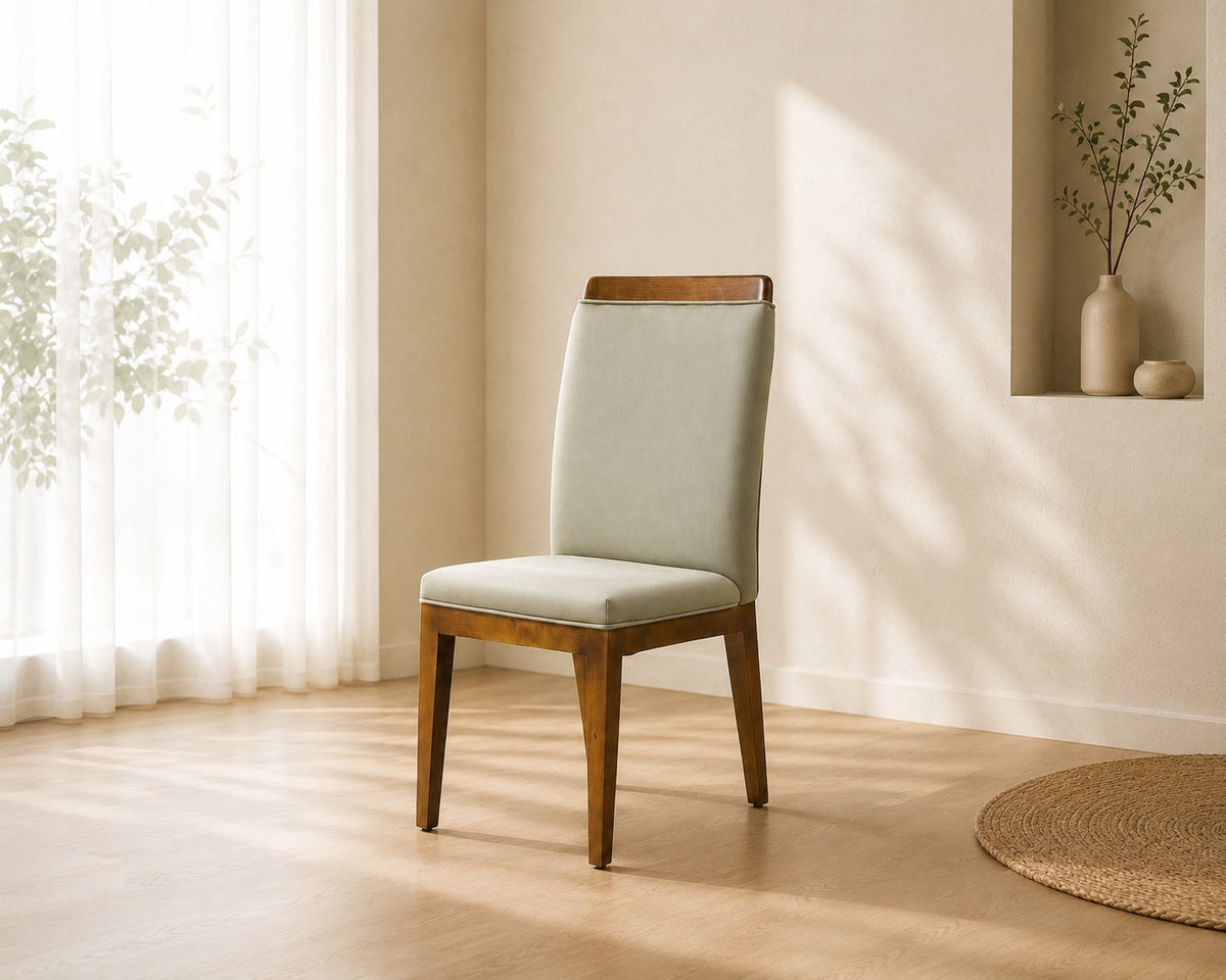 Elara dining chair in sage grey, shown in a styled room