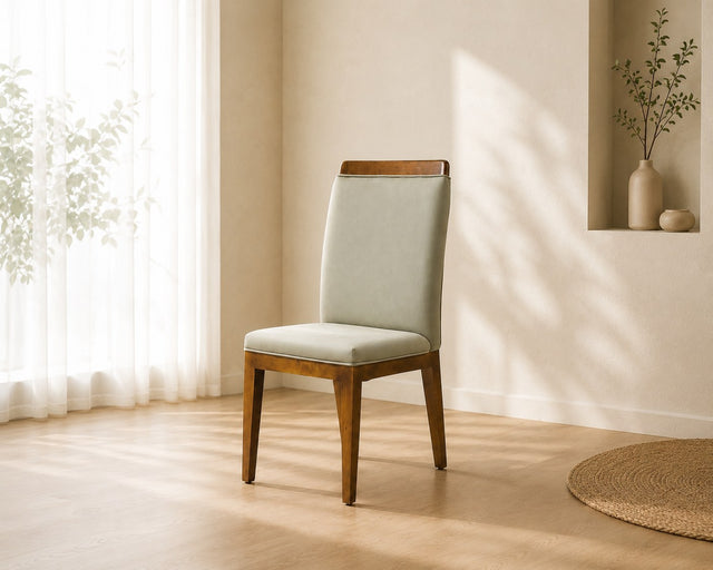 Elara dining chair in sage grey, shown in a styled room