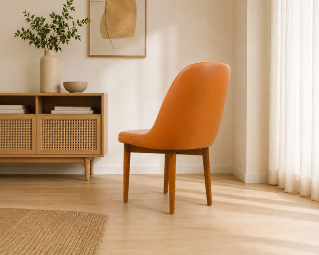 Sienna dining chair in burnt orange, shown in a styled room