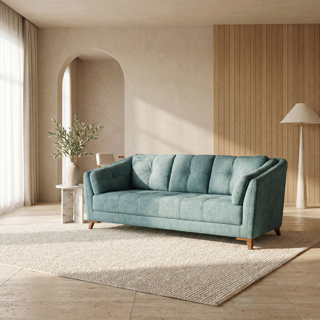 Celadon sofa in muted teal, shown in a styled room