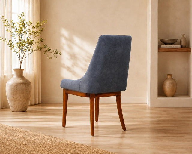 Livia dining chair in slate blue, shown in a styled room