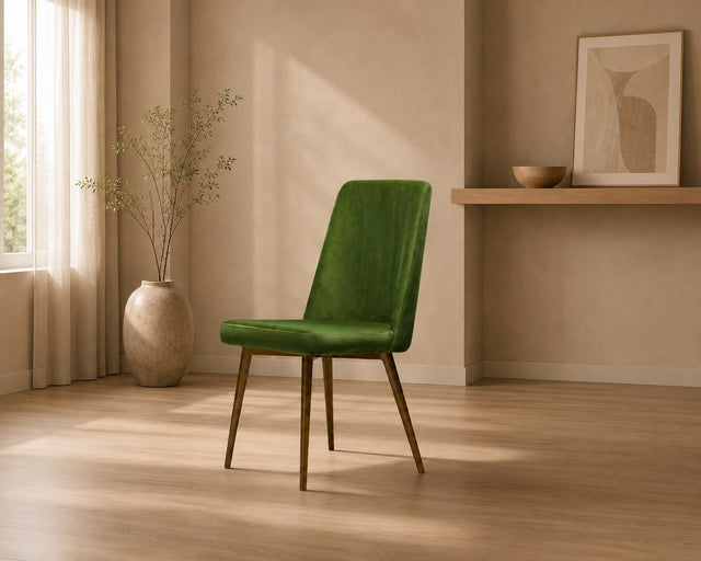 Fern dining chair in green, shown in a styled room